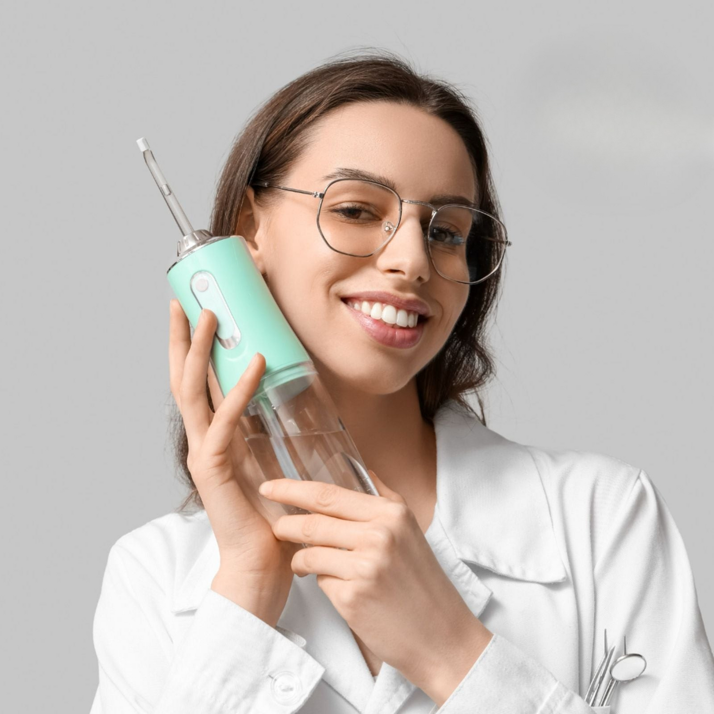 Woman using Best Portable Water Flosser – Cordless Oral Irrigator for Daily Dental Hygiene and Fresh Breath